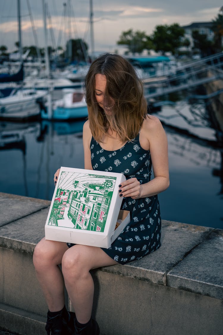 Woman Holding A Pizza Box 