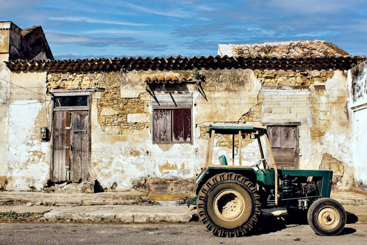 A Tractor Parked Outside A House