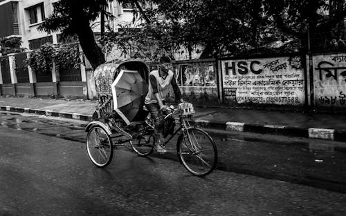 Street people's lifestyles during the rainy seasons.  City people waiting for the rain as the weather is so warm. This photo was taken on 2022-07-20, from Dhaka, Bangladesh, South Asia