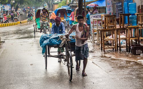 Street people's lifestyles during the rainy seasons.  City people waiting for the rain as the weather is so warm. This photo was taken on 2022-07-20, from Dhaka, Bangladesh, South Asia