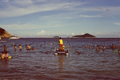 A Lifeguard Paddling a Raft