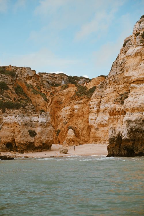 Free Explore the tranquil beauty of stunning coastal cliffs by the sea. Stock Photo