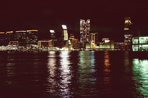 View of the City Buildings During Night Time