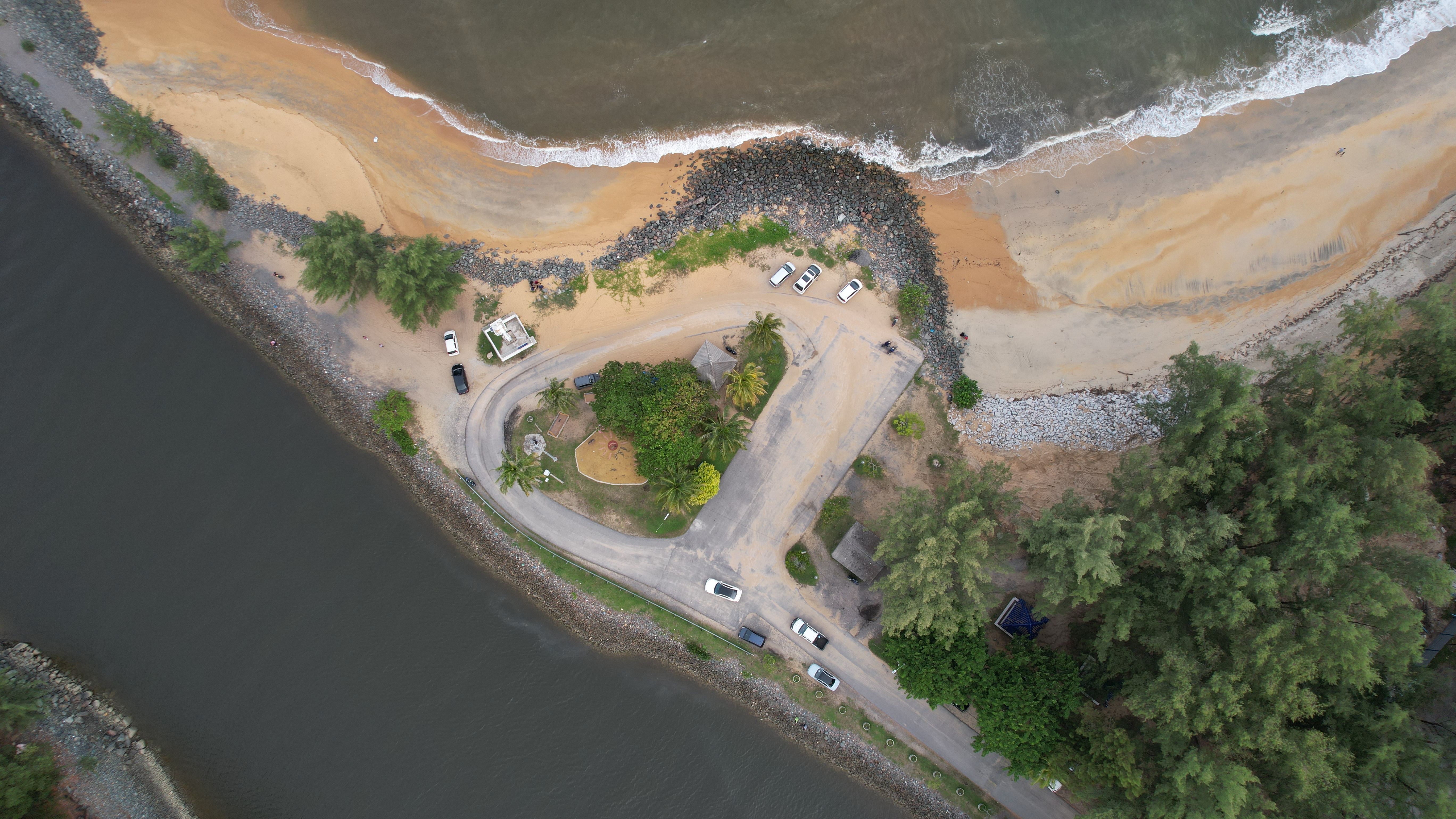 Aerial view of a river holiday resort surrounded by native bush and water