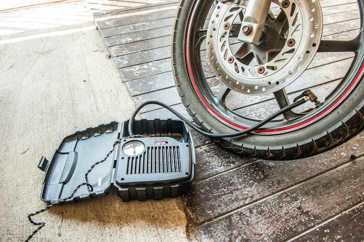 Close-up Of Bike Tire And Pump