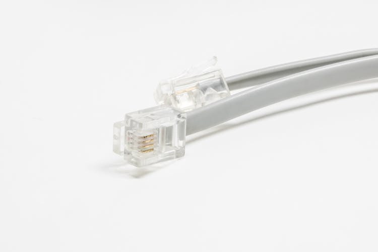 Clear Telephone Cable On A White Surface