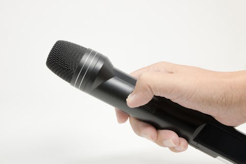 Hand Holding Microphone For Interview Stock Photo, Picture and Royalty Free  Image. Image 34877230.