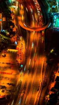 A vibrant aerial view of illuminated roads in Istanbul at night, showcasing the city's dynamic energy.