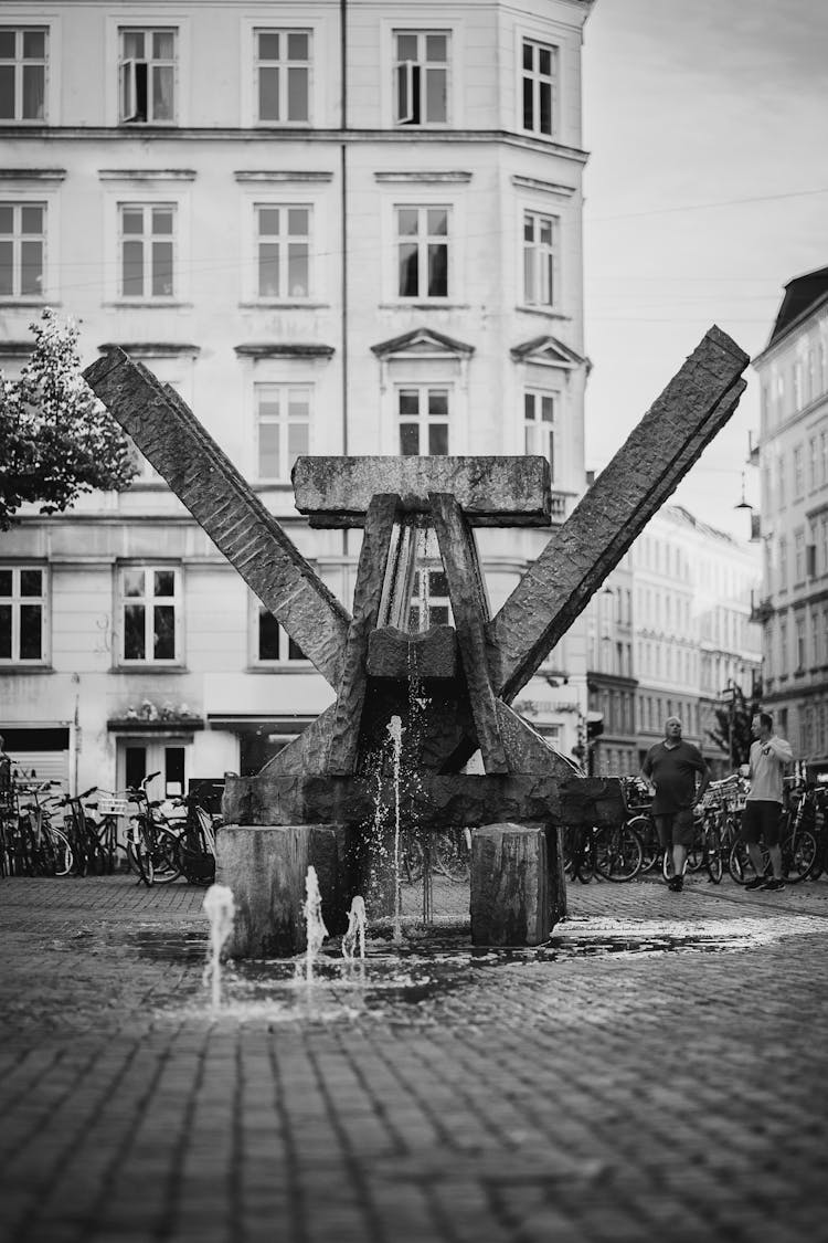 Monochrome Shot Of A Water Fountain Of Sankt Hans Torv In Denmark