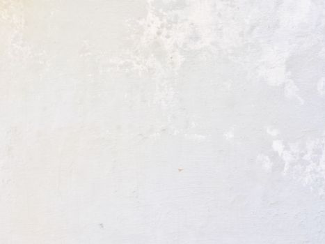 Close-up of a white concrete wall with textured surface for backgrounds and design ideas.