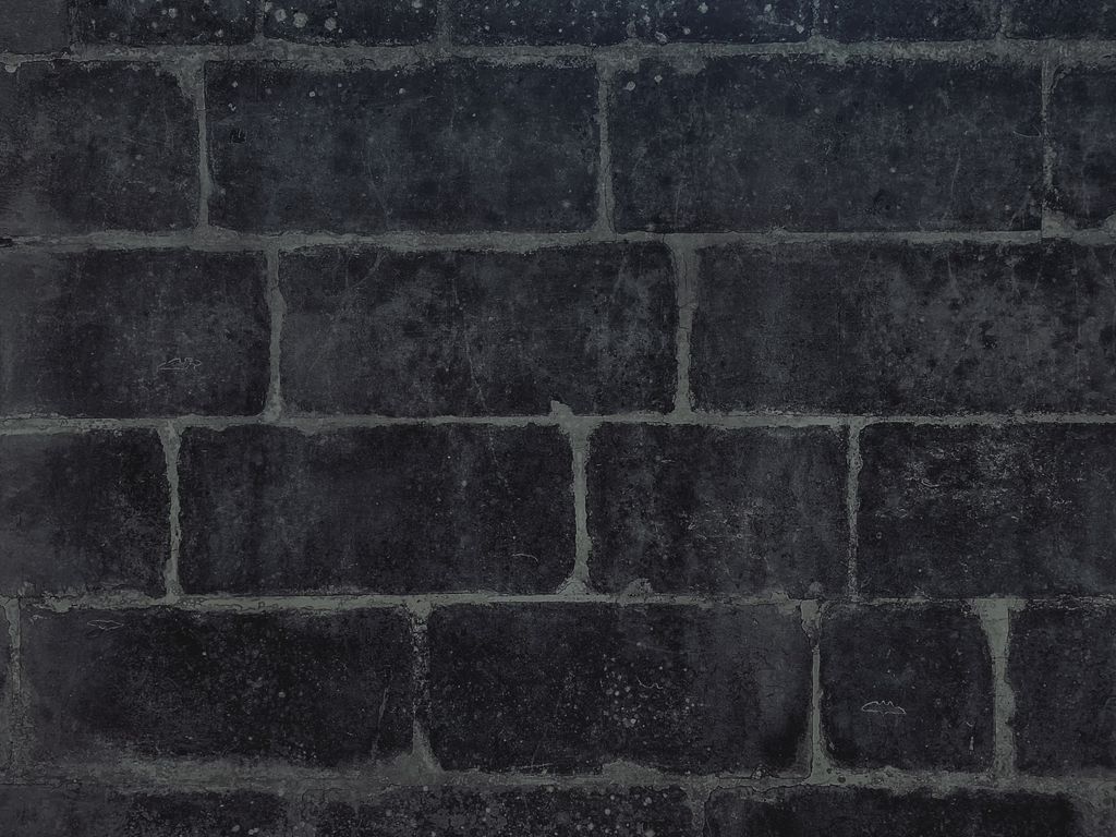 Repointed dark stone wall