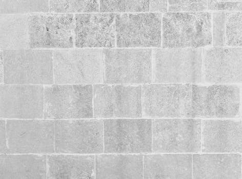 Black and white textured brick wall background suitable for designs.