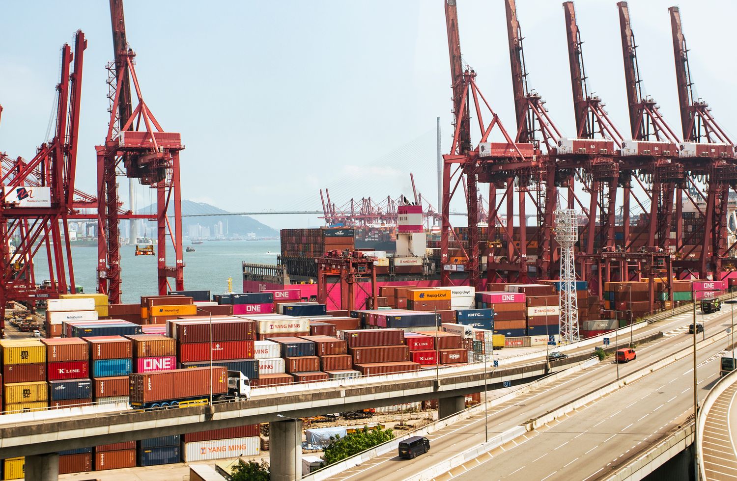 Hong Kong container port with cranes and cargo for international sea freight