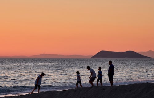 A Family Playing on Shore