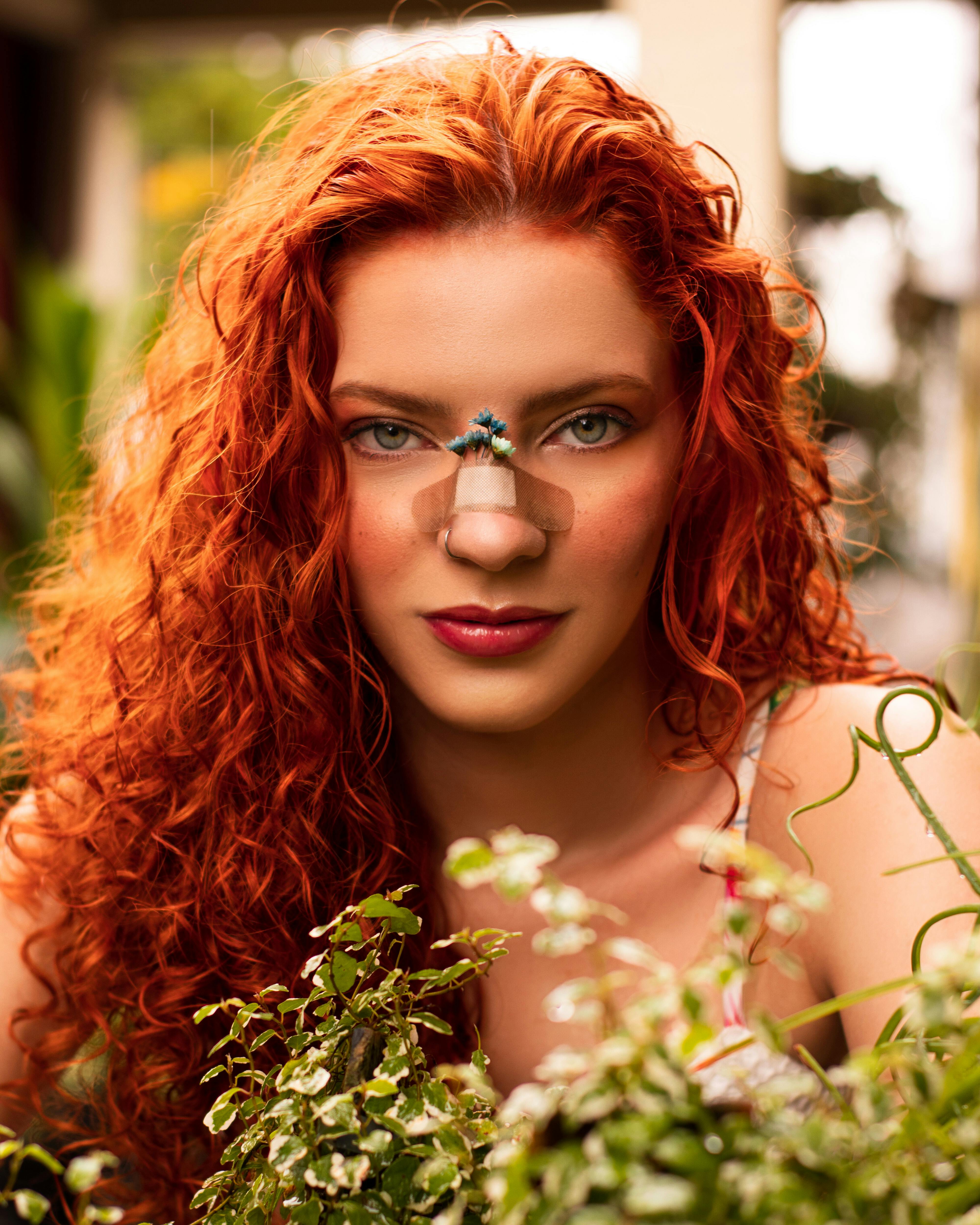 portrait of woman in red curly hair