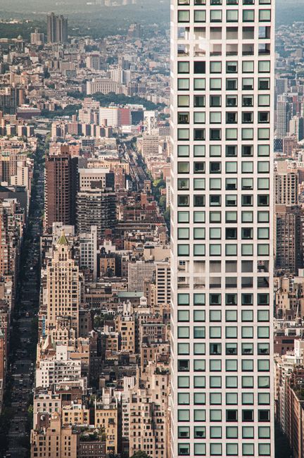 A dynamic aerial shot of New York City's dense skyscraper architecture.