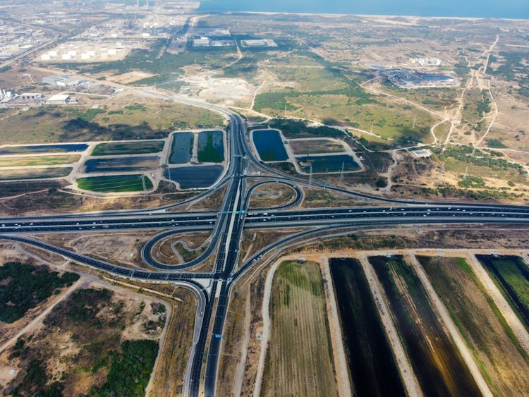 Drone Shot Of An Interchange Near Farm Fields