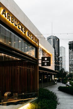 Modern Starbucks Reserve building in Guadalajara with outdoor seating and city view.