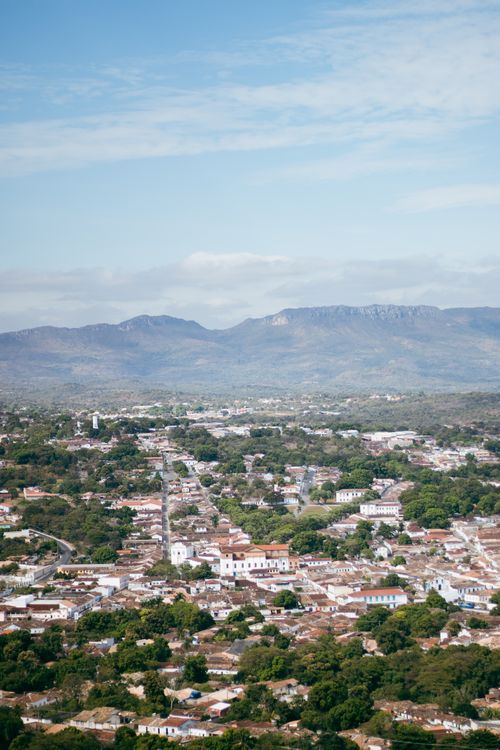 Free Explore this aerial shot of a picturesque Brazilian town nestled near mountains. Stock Photo