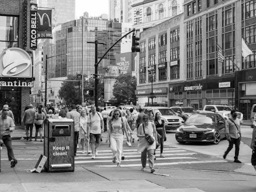 Grayscale Photo of People Walking on Street