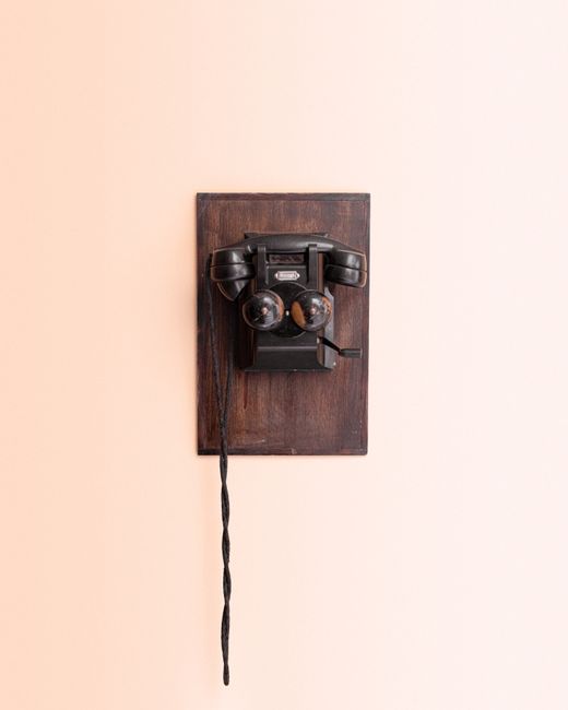 Retro wall-mounted telephone in Bolivia. Classic design and vintage appeal.