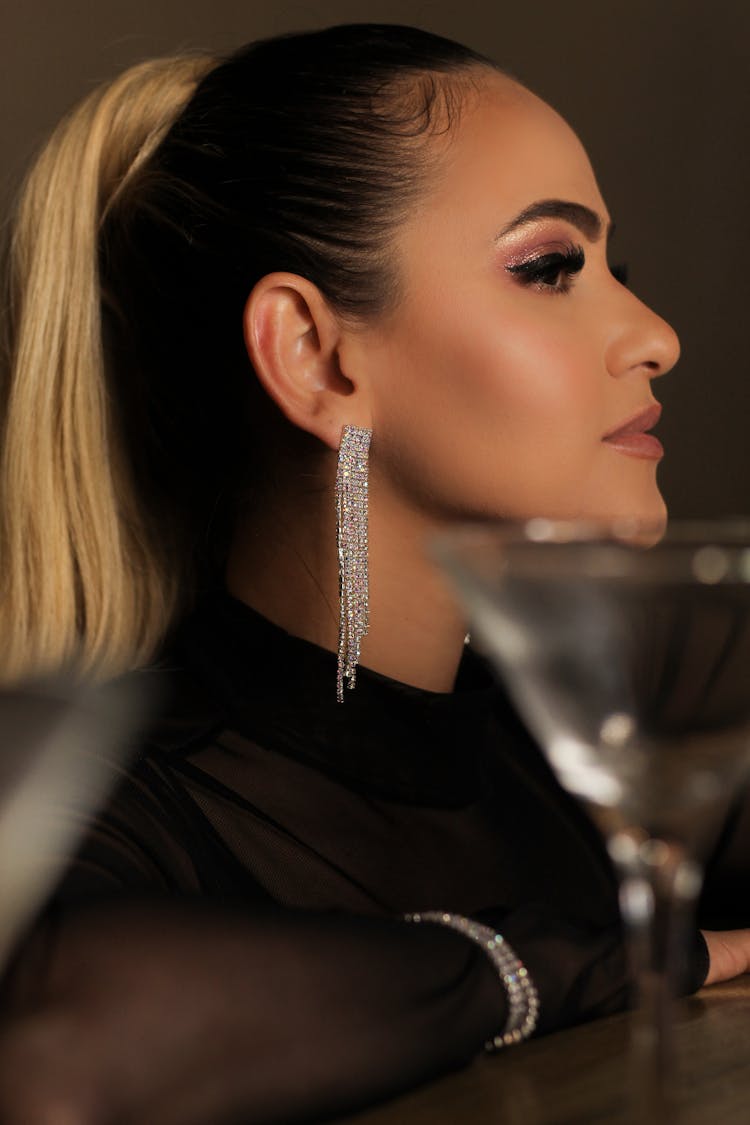 Close Up Photo Of Woman Wearing Diamond Earring