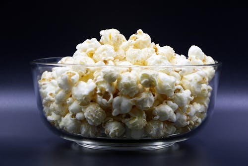 Free A Glass Bowl Filled With Popcorn  Stock Photo