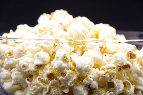 Close-Up Shot of Popcorn in a Glass Bowl