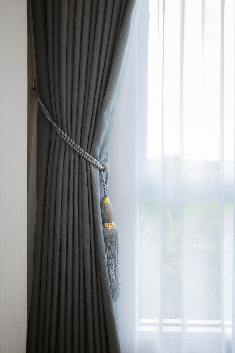 Grey velvet curtain with tieback