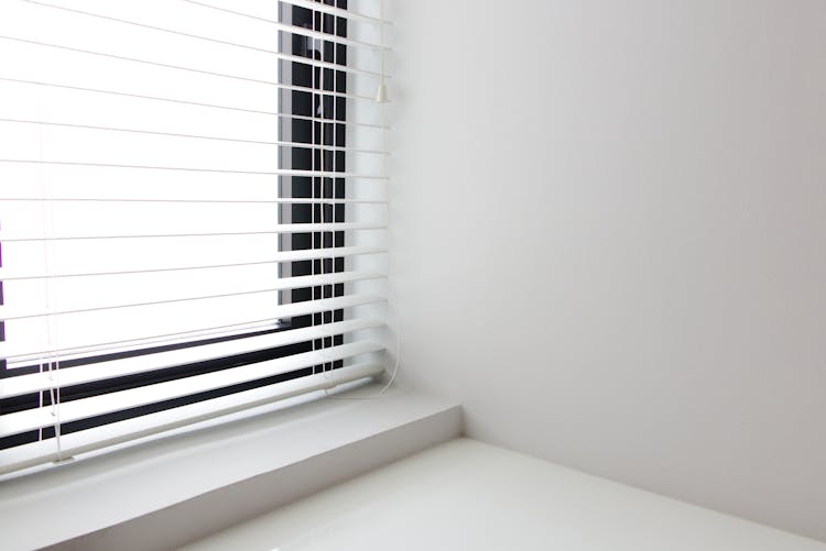 White Window Blinds On White Wall