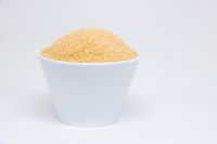 Bowl of brown sugar on a white background — photo by Srattha Nualsate on Pexels