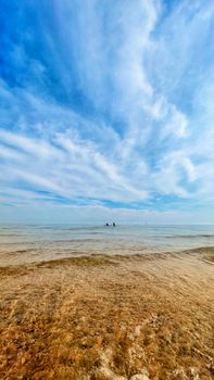 A serene beach view with clear skies at Cobourg, Ontario, showcasing natural beauty and tranquility.