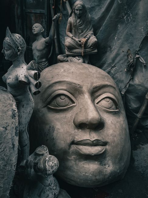 Detailed view of traditional Hindu sculptures being crafted in Kolkata, India.