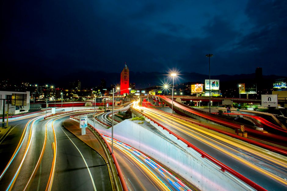 Captivating night view showcasing light trails on a bustling highway in Monterrey, Mexico.