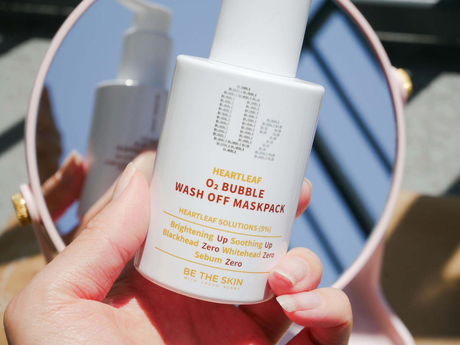 Close-up of Heartleaf O2 Bubble Wash Off Maskpack showing packaging and reflection.