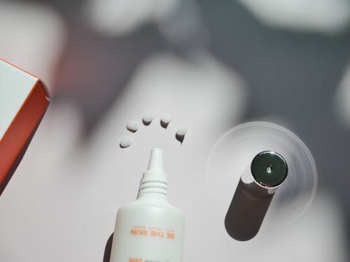 Dots of Cosmetic Product on White Surface