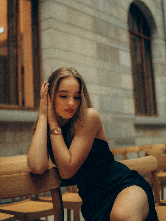 Woman in Black Dress Sitting on a Chair · Free Stock Photo