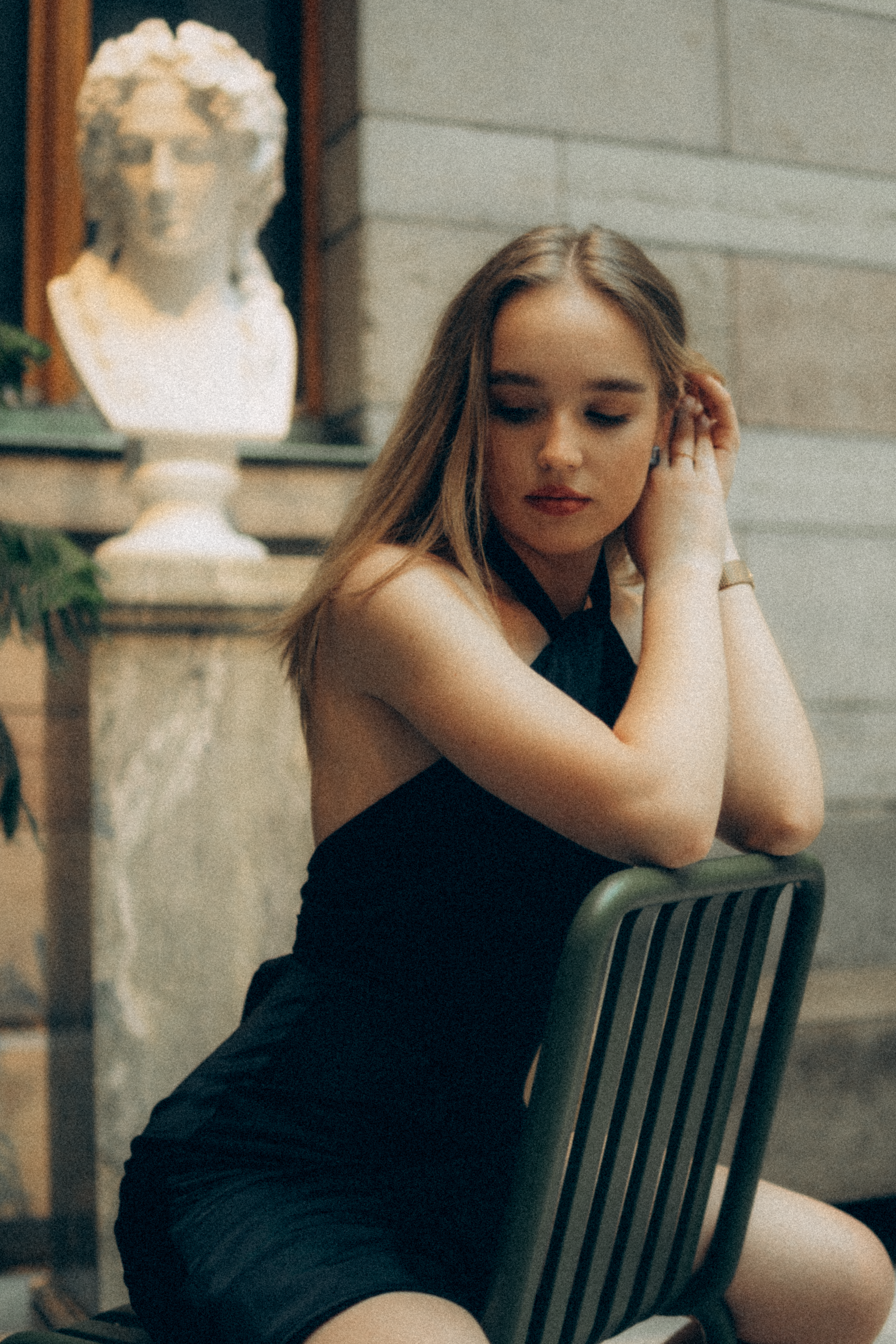 Photo of Woman in Black Dress Sitting on a Chair · Free Stock Photo