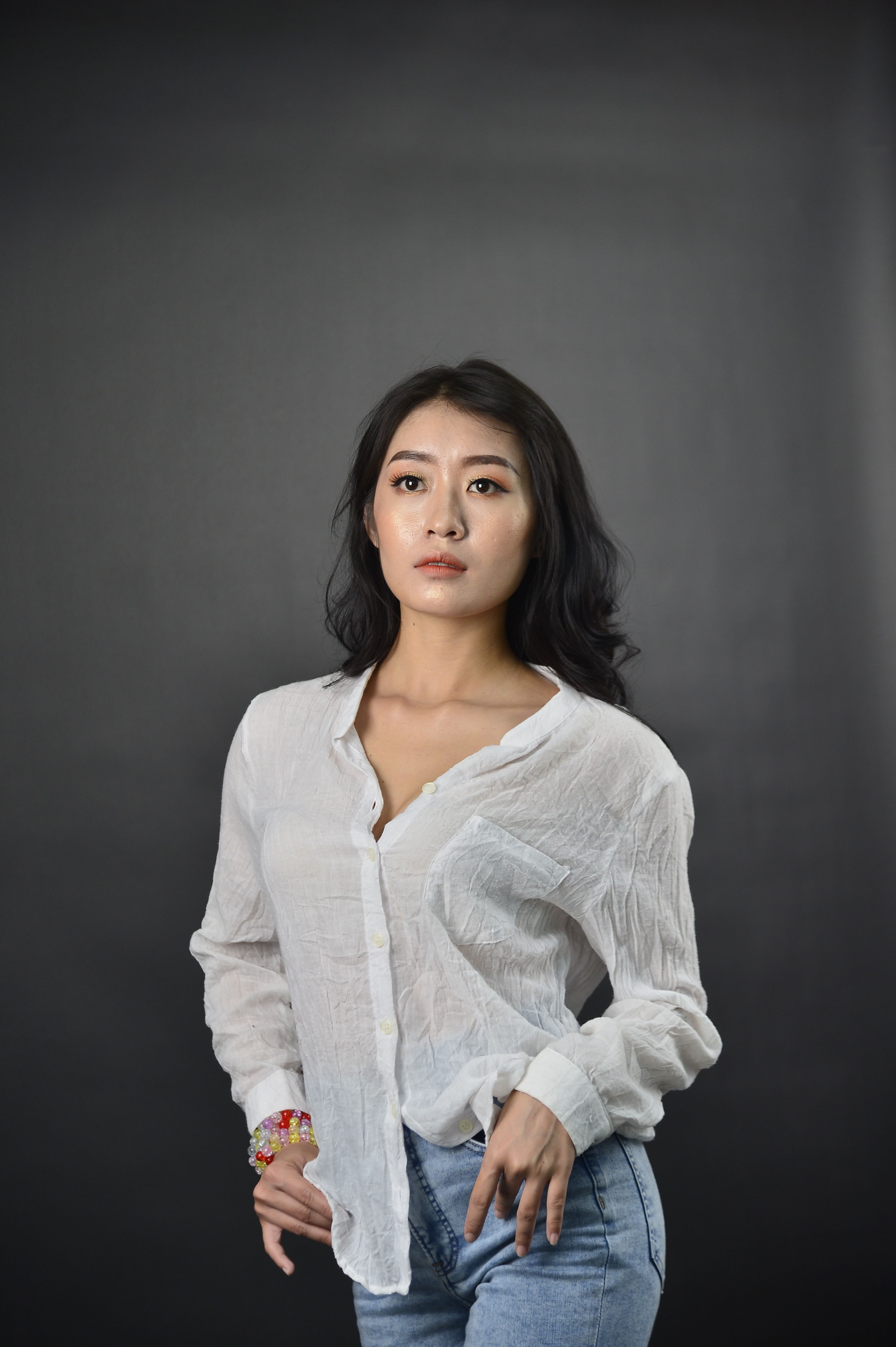 A Woman in White Long Sleeve Shirt · Free Stock Photo