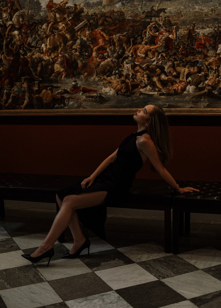 Elegant Woman In Dress Posing In Museum