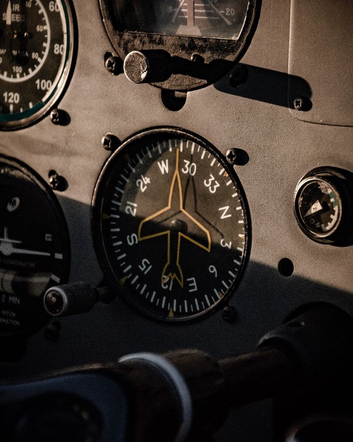 Aircraft cockpit dashboard with compass and navigation dials