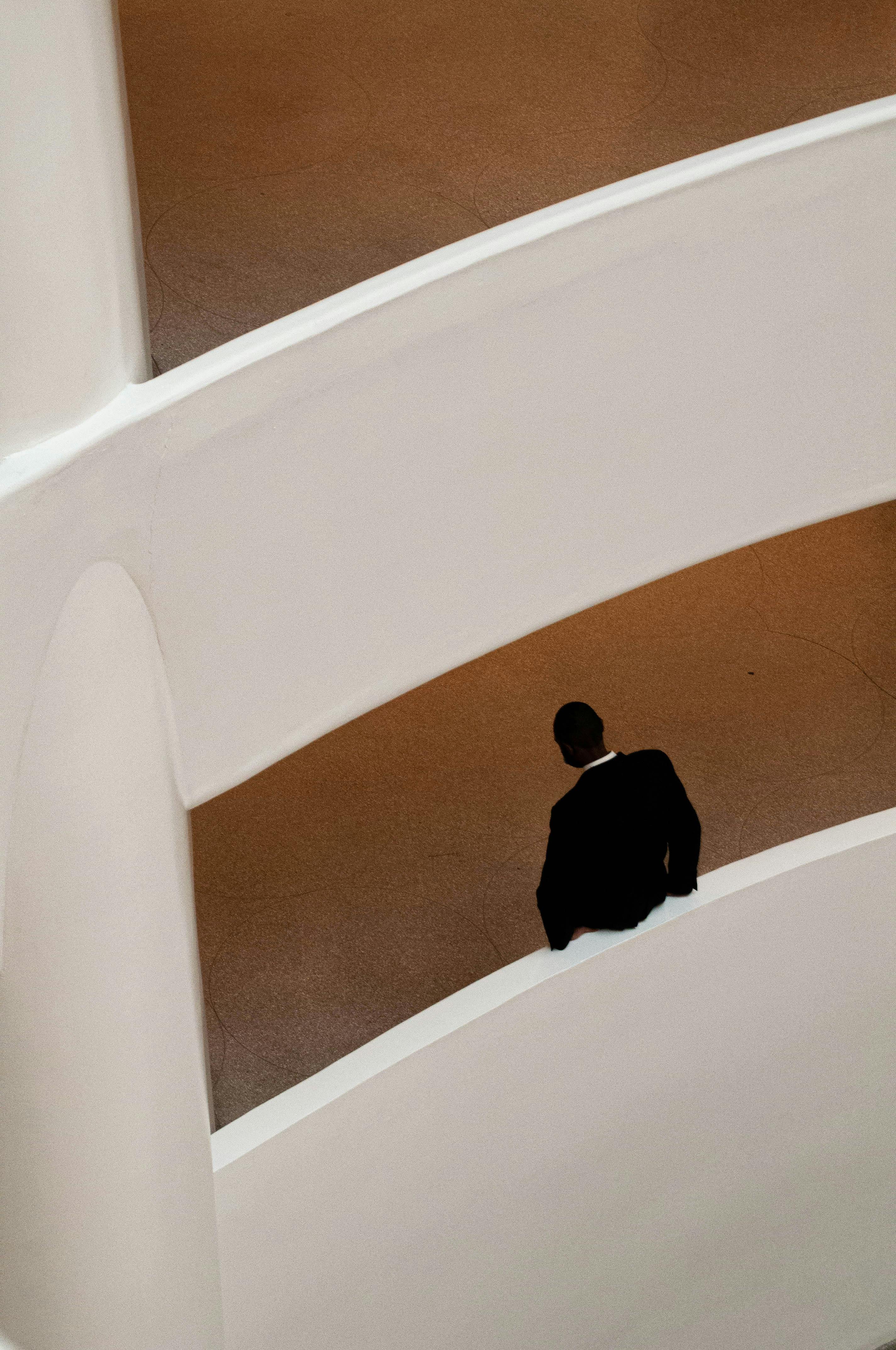 Elegant art museum interior with man in suit, New York.