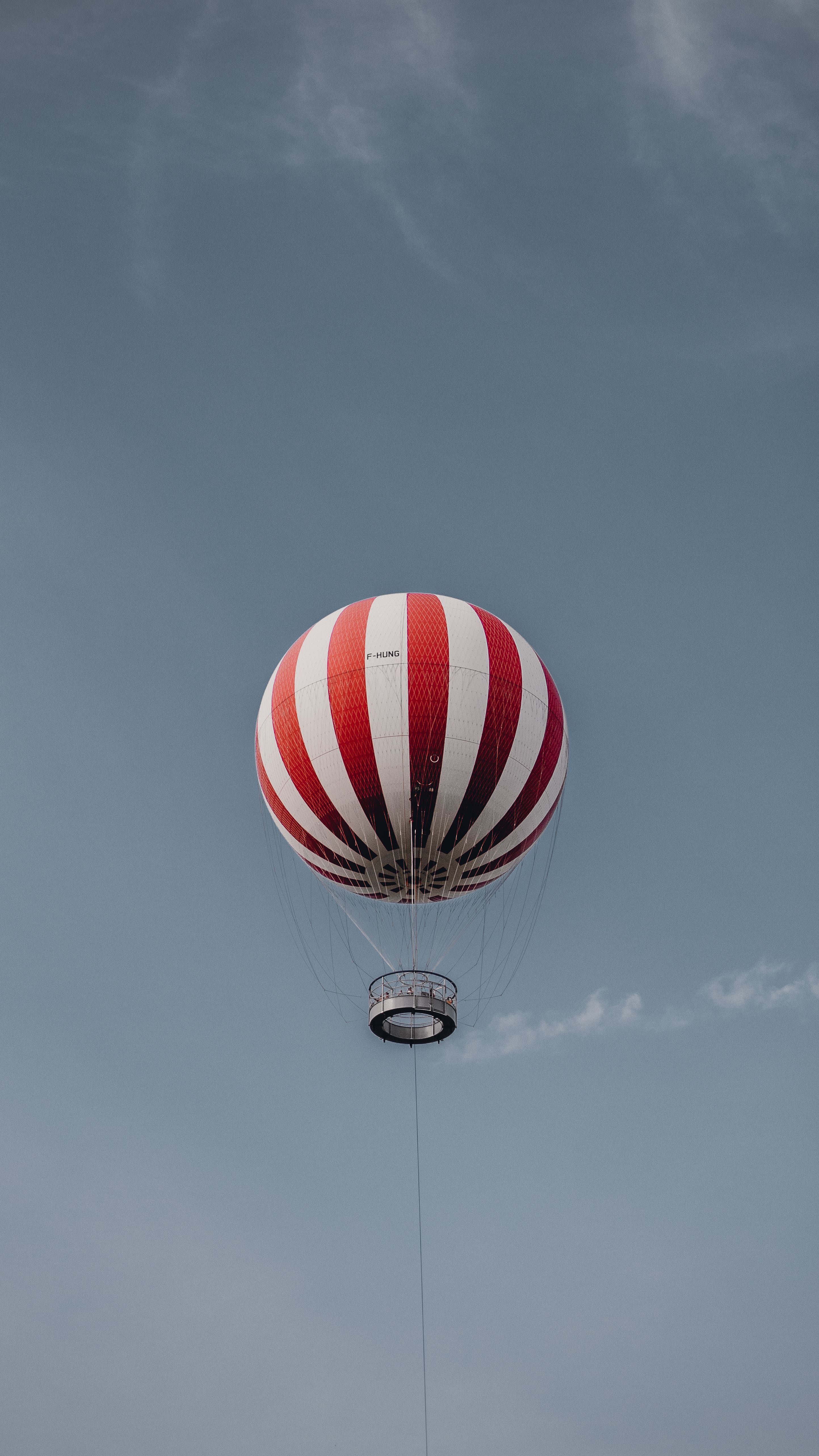 A Red and White Hot Air Balloon Flying on Mid Air Under Blue Sky · Free ...