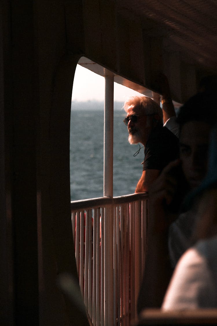 A Bearded Man Travelling In A Ferry