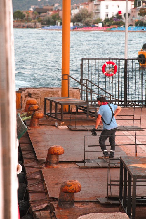 Man Standing on a Dock