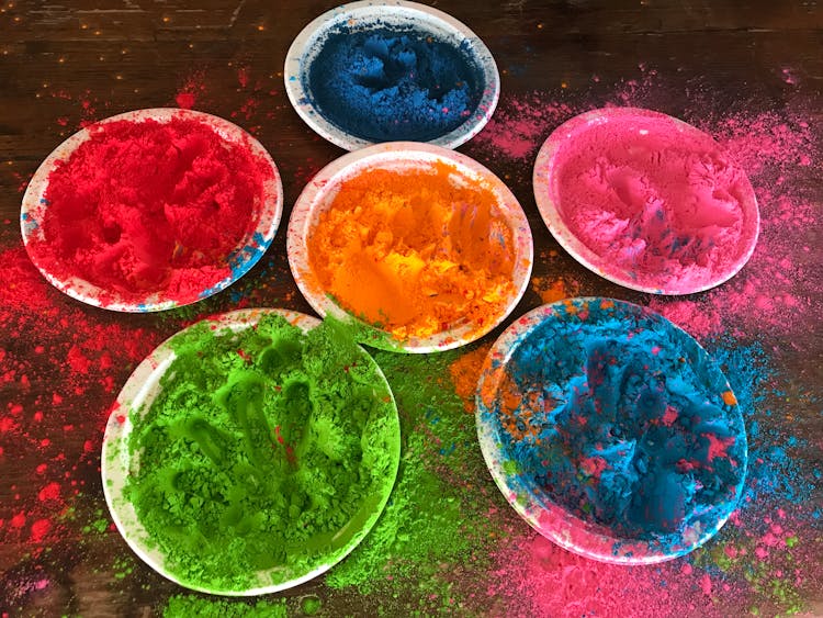 Plates With Colorful Powder On Floor