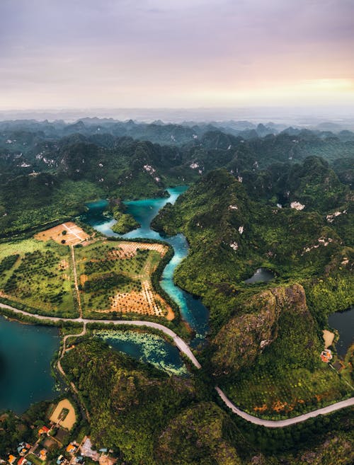 Road Crossing Dramatic Mountain Terrain with Plantations