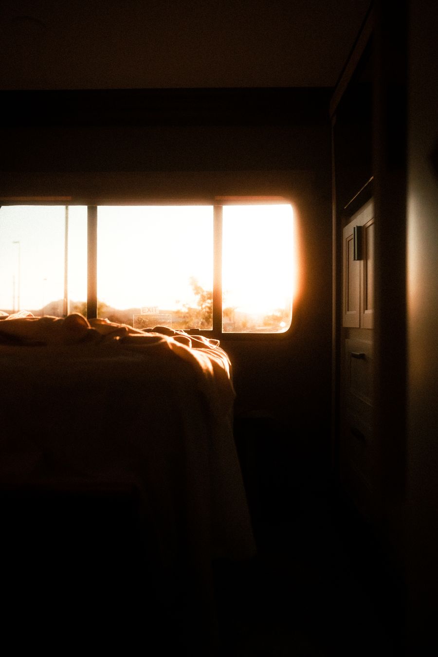 Early morning light coming through a bedroom window