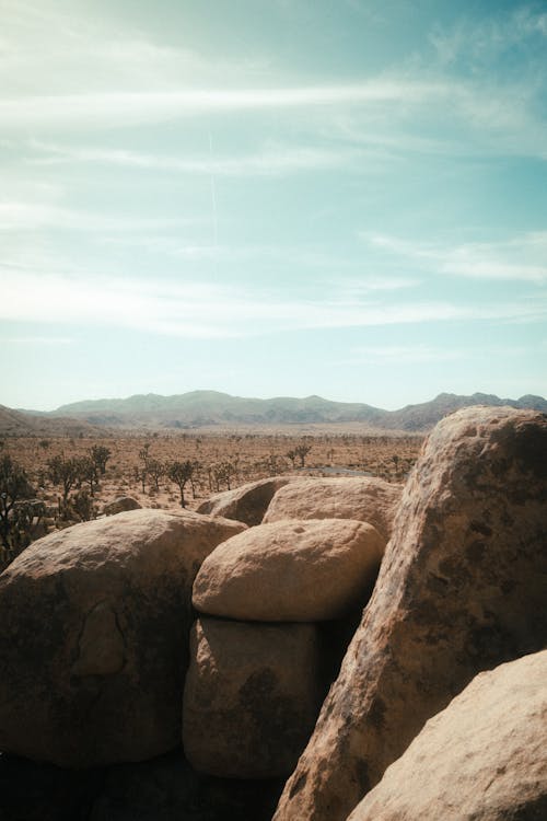 Brown Rocks in the Desert Under Blue Sky