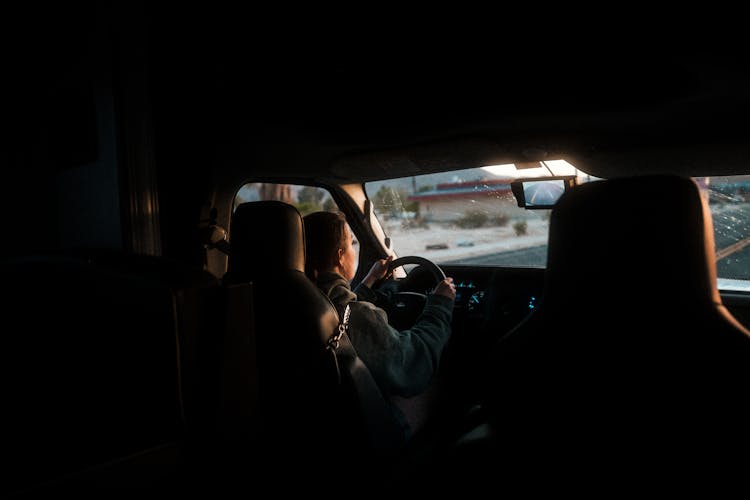 A Woman Driving A Vehicle